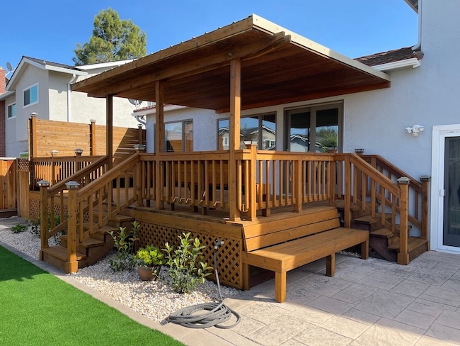Restored exterior wood deck after professional refinishing and staining